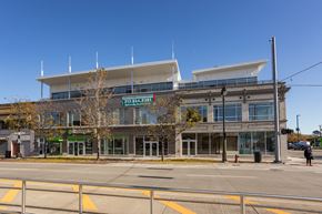 Detroit apartment for rent - A building with a green awning and a sign that reads "STX 2000" is in the background.