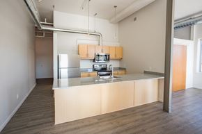 Detroit apartment for rent - A kitchen with a counter and cabinets.