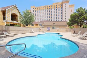 Las Vegas apartment for rent - A large swimming pool in front of a hotel.
