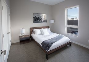 Fargo apartment for rent - A bedroom with a bed and two nightstands at RoCo Apartments, Fargo, North Dakota 58102