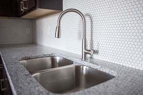 Fargo apartment for rent - A kitchen sink with a faucet in a 555 waverly unit  at RoCo Apartments, Fargo, North Dakota, 58102