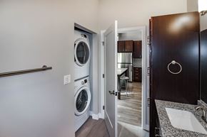 Fargo apartment for rent - A bathroom with a washer and dryer  at RoCo Apartments, Fargo, ND 58102