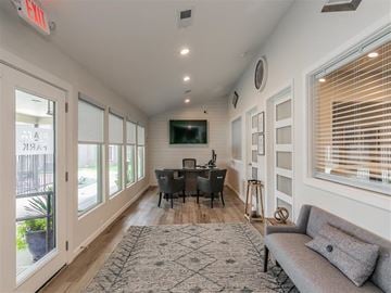 North Richland Hills apartment for rent - a living room with a couch and a table with chairs