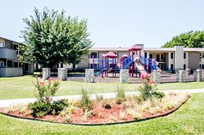 North Richland Hills apartment for rent - Playground with slides and swings at Riata Park community