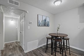 Victoria apartment for rent - Dining nook with modern décor and dark wood flooring