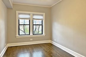 Oak Park apartment for rent - A room with a window and wooden flooring.