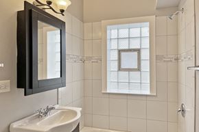 Oak Park apartment for rent - A bathroom with a white sink and a mirror.