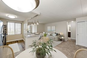 Laurel apartment for rent - A white dining room with a round table and chairs.