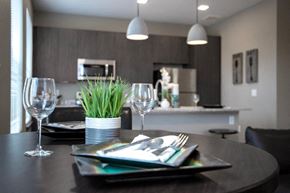 Loveland apartment for rent - A modern dining room with a table set for two.