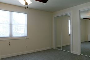 De Pere apartment for rent - a bedroom with a large window and a mirrored closet