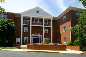 Oshkosh apartment for rent - the front of a large brick building with a porch