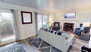 Oshkosh apartment for rent - a living room with a couch and a fireplace