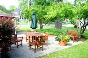 Appleton apartment for rent - a patio with a table and chairs and an umbrella