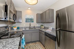 Columbia apartment for rent - a kitchen with stainless steel appliances and granite counter tops