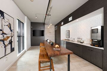San Diego apartment for rent - A modern kitchen with a wooden table and chairs.