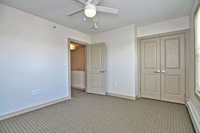 Westport apartment for rent - a living room with two doors and a ceiling fan