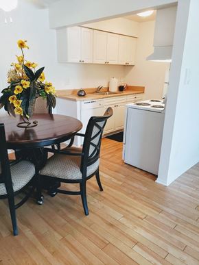 Detroit apartment for rent - a small kitchen with a dining table and chairs