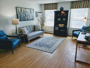 Detroit apartment for rent - a living room with a couch and a table