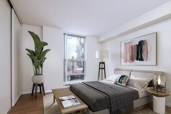 Mississauga apartment for rent - a bedroom with a bed and a large window