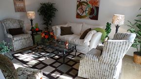 Charleston apartment for rent - a living room with white furniture and a checkered rug