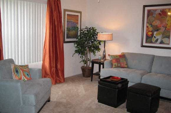 Charleston apartment for rent - a living room with a couch and a chair