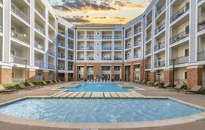 Nashville apartment for rent - a large swimming pool in front of an apartment building