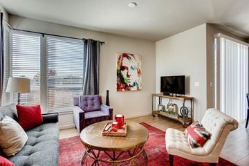 Evans apartment for rent - a living room with a couch and a table