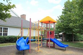 Martinsburg apartment for rent - a playground with a swing set and slides