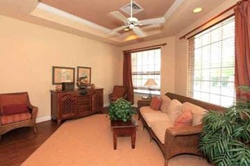 Martinsburg apartment for rent - a living room with a couch and a ceiling fan