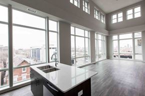 Chicago apartment for rent - A kitchen with a large island and a view of the city.