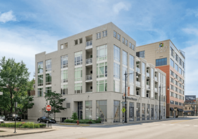 Chicago apartment for rent - A modern building with a sign that says "House of Peace" on it.