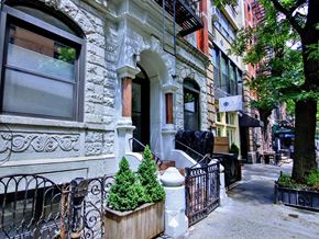 New York apartment for rent - a building on a city street with trees in front of it