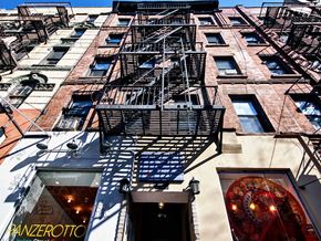 New York apartment for rent - a fire escape on the side of a building