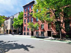 New York apartment for rent - a red brick apartment building on a city street