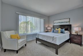 Redwood City apartment for rent - a bedroom with a bed and a chair