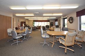 Maple Plain apartment for rent - a conference room with tables and chairs and chairs