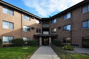Maple Plain apartment for rent - a brick building with a sidewalk in front of it