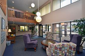 Rogers apartment for rent - a large lobby with chairs and a table