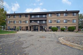 Rogers apartment for rent - an office building with an empty parking lot