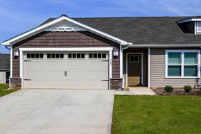 Concord apartment for rent - A house with a brown garage door and a grey wall.