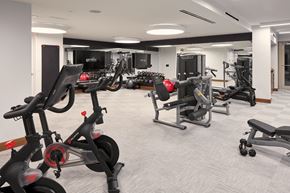 Coral Gables apartment for rent - a gym full of exercise bikes and other equipment in a building