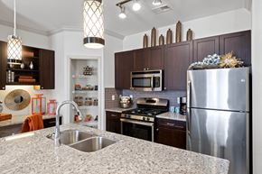 Ashburn apartment for rent - Kitchen with stainless steel appliances and pantry at Atley on the Greenway Apartments in Ashburn, VA