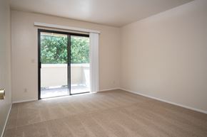 Novato apartment for rent - an empty living room with a sliding glass door