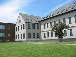 Rochester apartment for rent - a couple of white buildings with solar panels on the roof