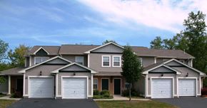 Rochester townhouse for rent - a house with two garage doors on a street