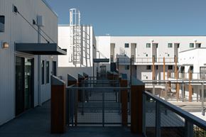 Mesa apartment for rent - a view of a building with stairs and a fence