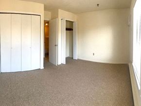 Guilford apartment for rent - an empty living room with white walls and carpet