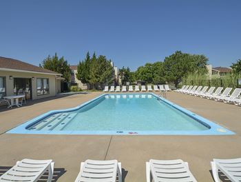 Spacious sundeck surrounding outdoor pool