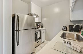 Los Angeles apartment for rent - a kitchen with stainless steel appliances and white cabinets