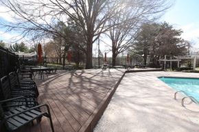 Winston-Salem apartment for rent - a swimming pool with benches next to it